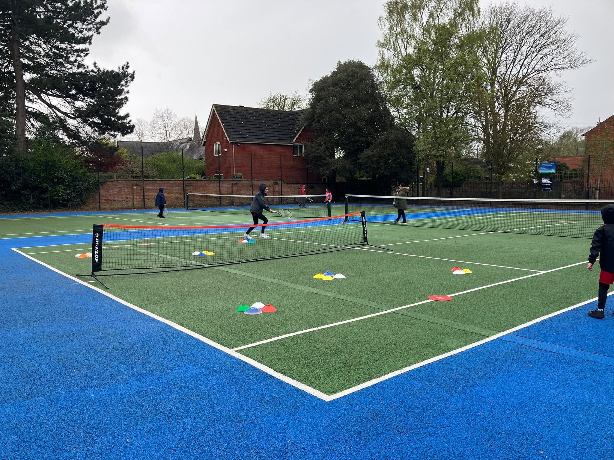 Tennis session in progress on a We Do Tennis court